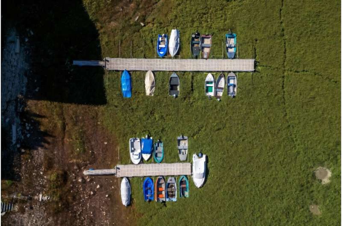 Boats stranded on the bed of the Lac des Brenets. Boats stranded on the bed of the Lac des Brenets